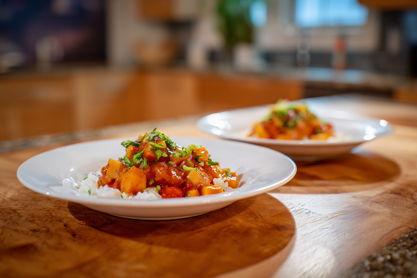 Cozy Rustic Meal: Two Plates of Food on a Wooden Table