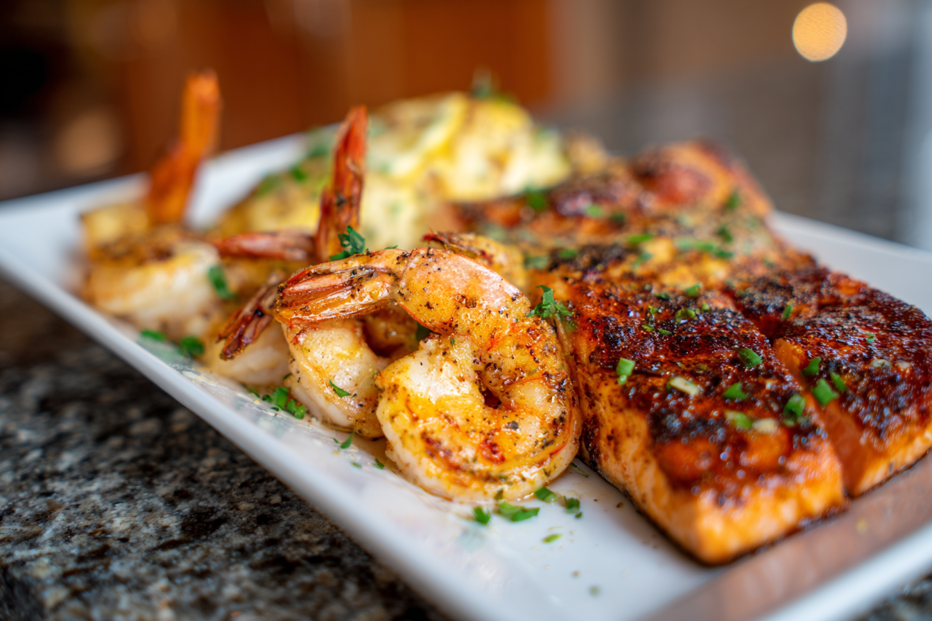 Southern Comfort Seafood Skillet: Cajun Salmon and Shrimp with Creamy Garlic Sauce